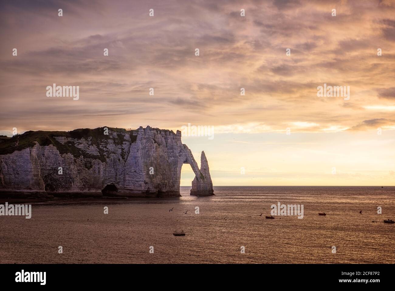 Famouse cliffs of Etretat, france, at sunset Stock Photo - Alamy