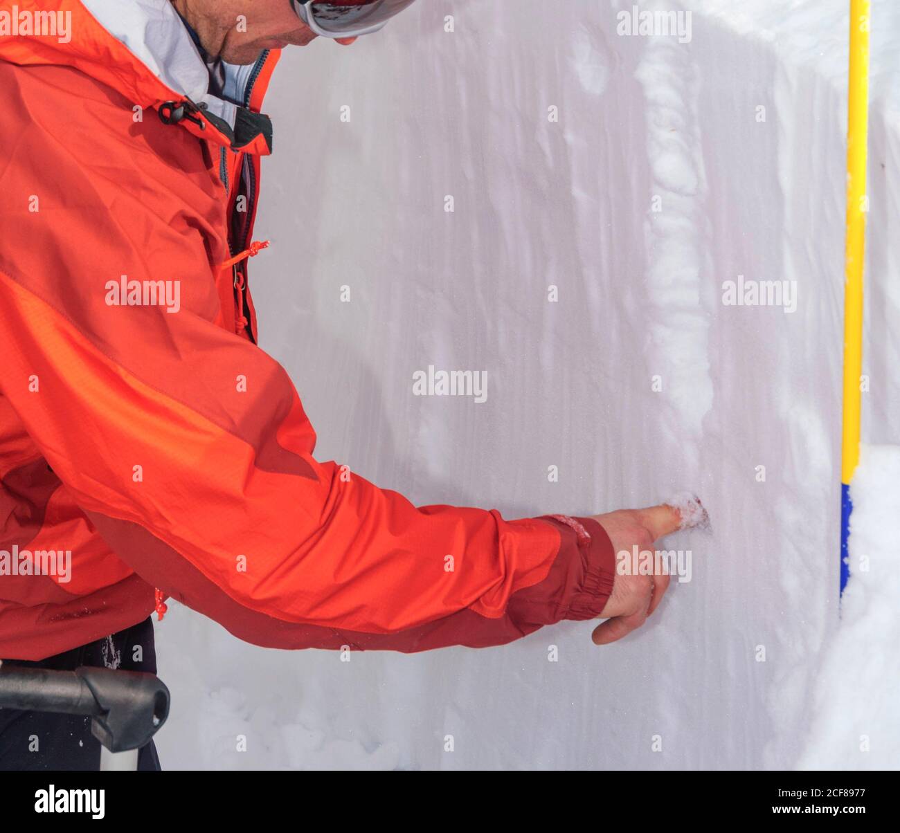 mountain guide for a risk assessment of the avalanche situation Stock