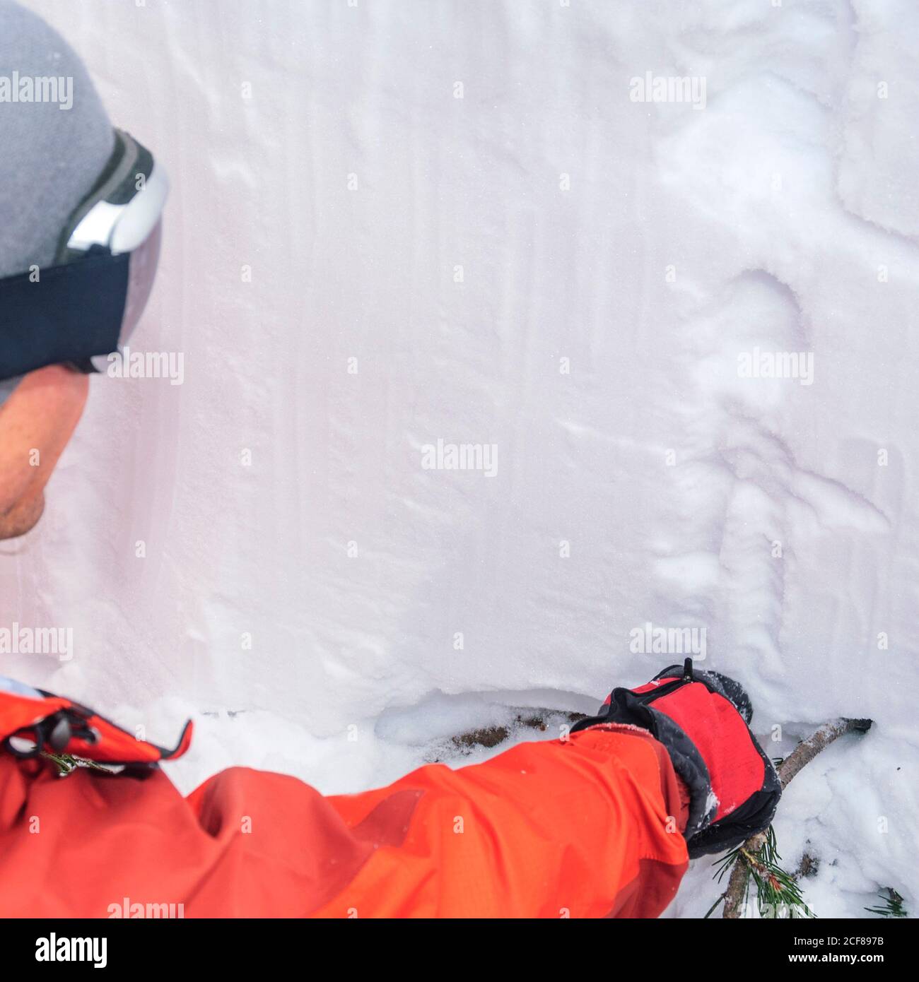 mountain guide for a risk assessment of the avalanche situation Stock