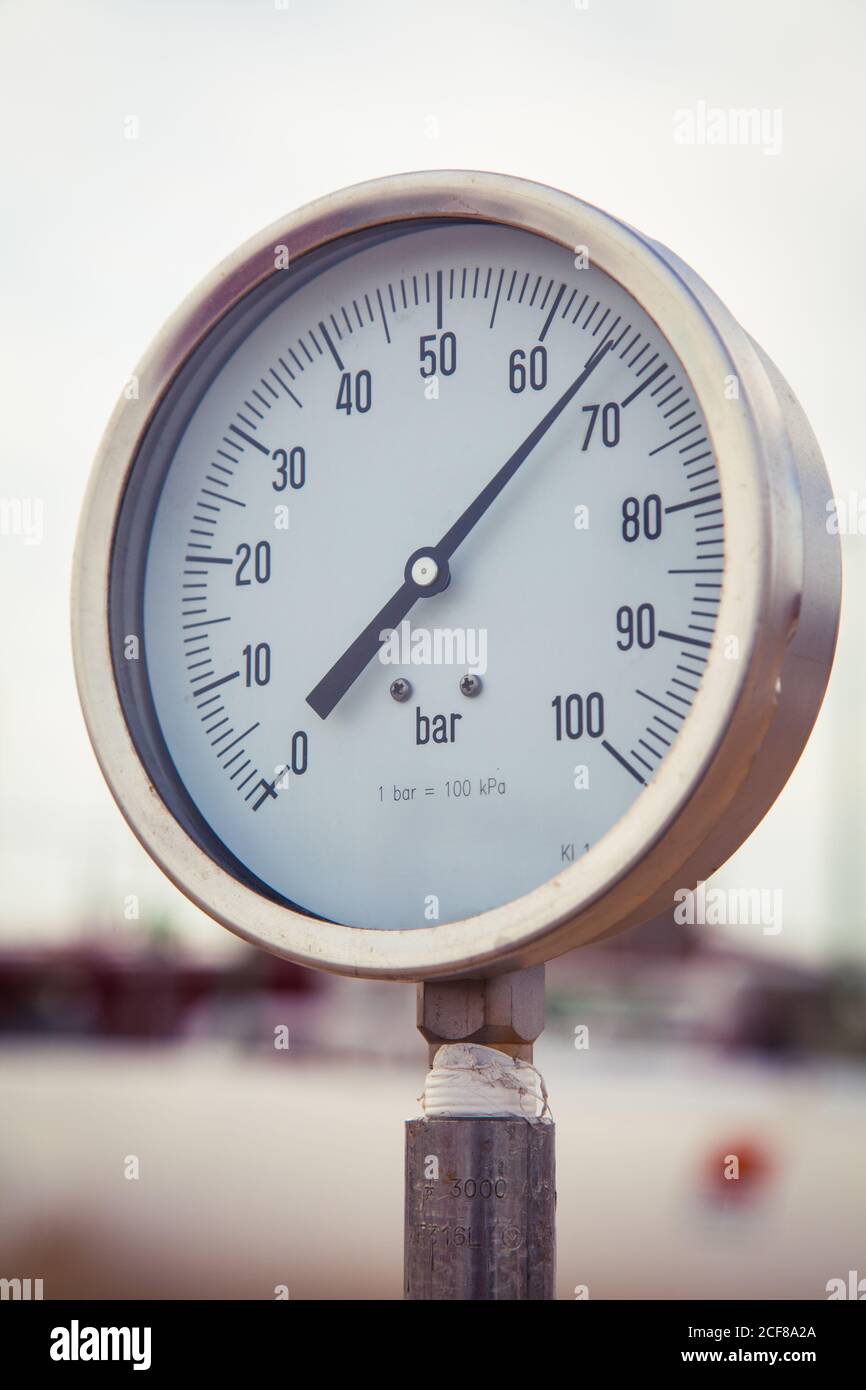 Low angle of manometer measuring gas pressure in pipes at plant in