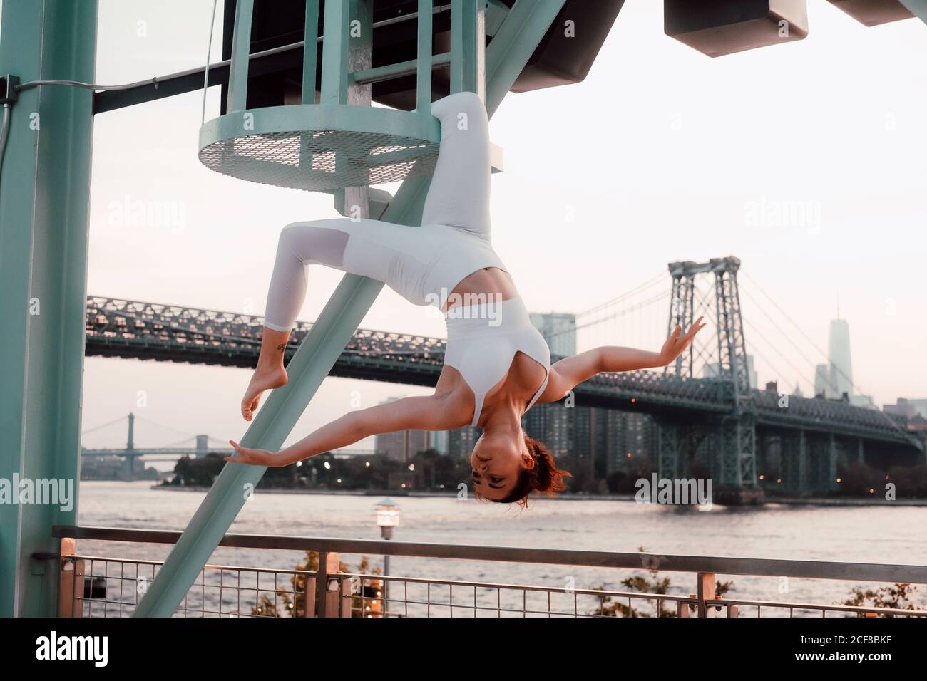 Woman hanging upside down from hi-res stock photography and images - Alamy