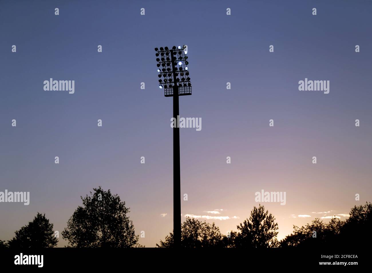 Closeup of a stadium lights with blue sky. Lithuania, Kedainiai Stock Photo