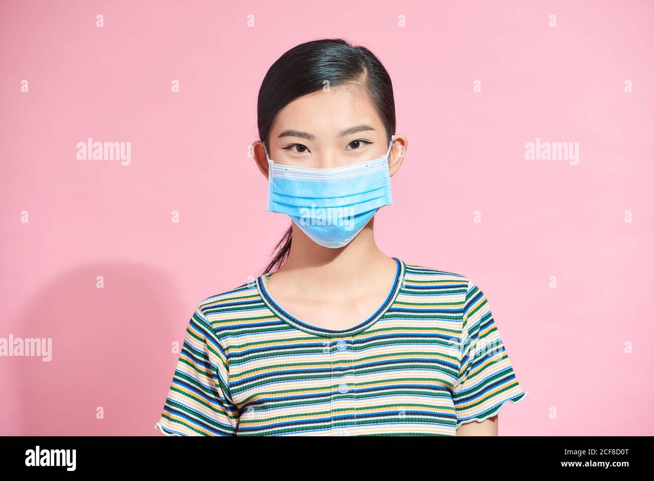 close up woman face is wearing surgical mask Stock Photo