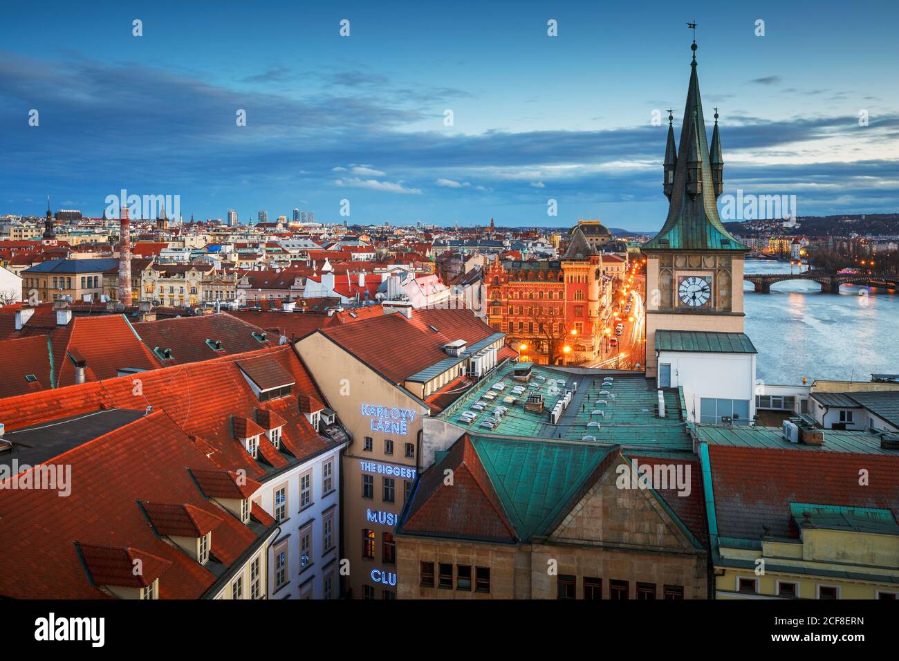 Prague, Czech Republic - March 9, 2019: Evening view of Old Town Water Tower and river Vltava. Stock Photo