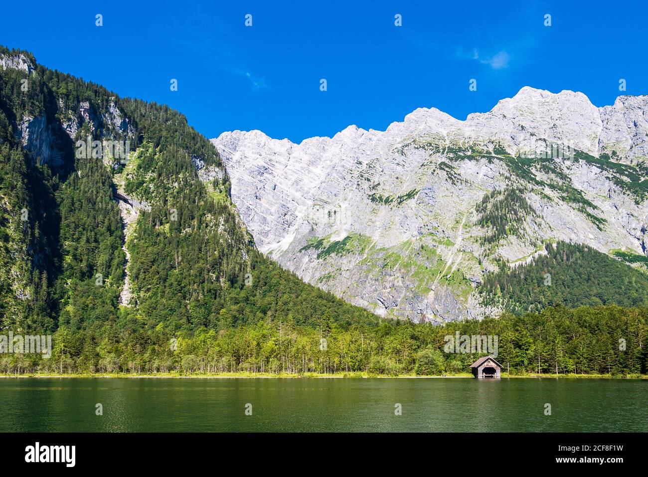Lake Koenigssee with rocks and trees in the Berchtesgaden Alps, Germany ...