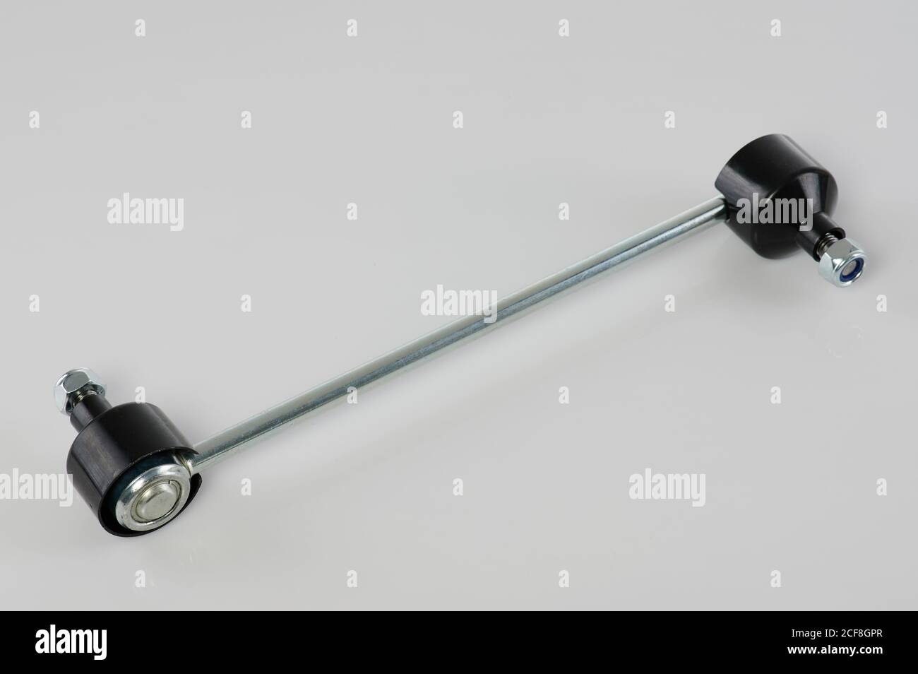 One car tie rod with metal bar and plastic ball isolated on white