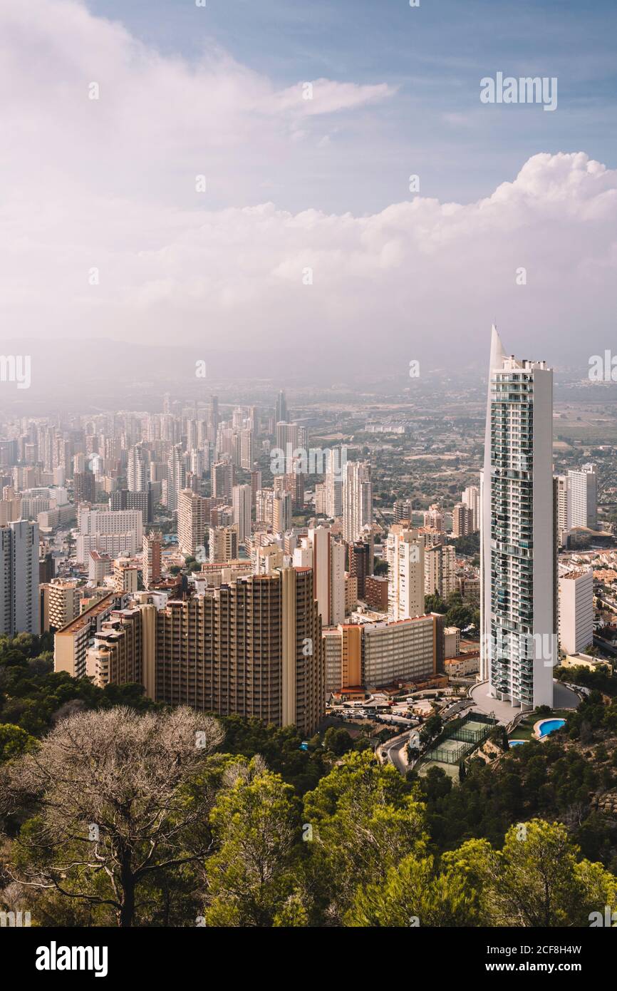 From above cityscape of densely built Benidorm city district with contemporary skyscrapers covered with haze in Spain Stock Photo