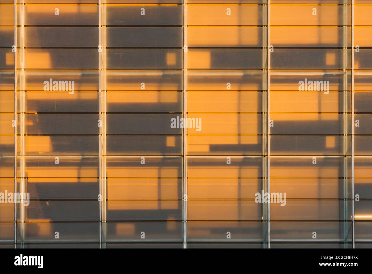 Rectangular on wall of building with dark contrast shadow in sunset ...