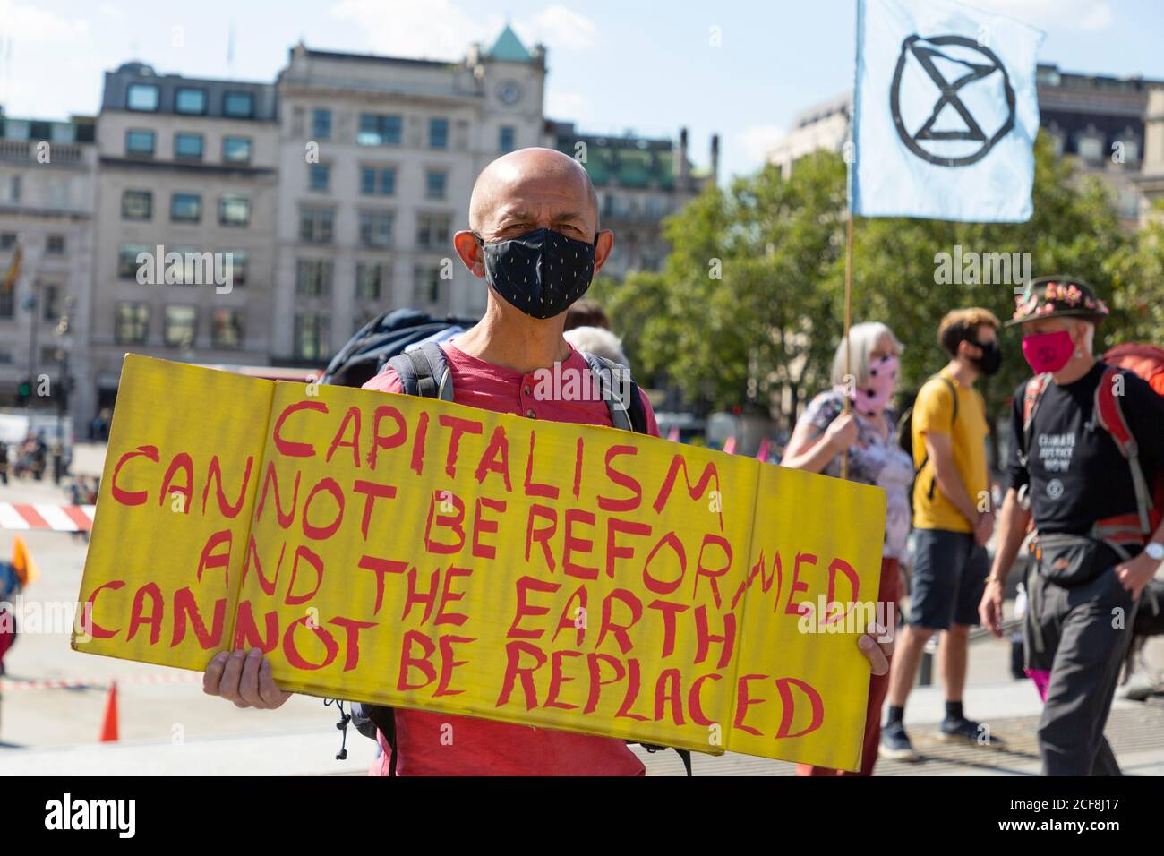 Protester holding a sign during Extinction Rebellion demonstration, Trafalgar Square, London, 1 September 2020 Stock Photo