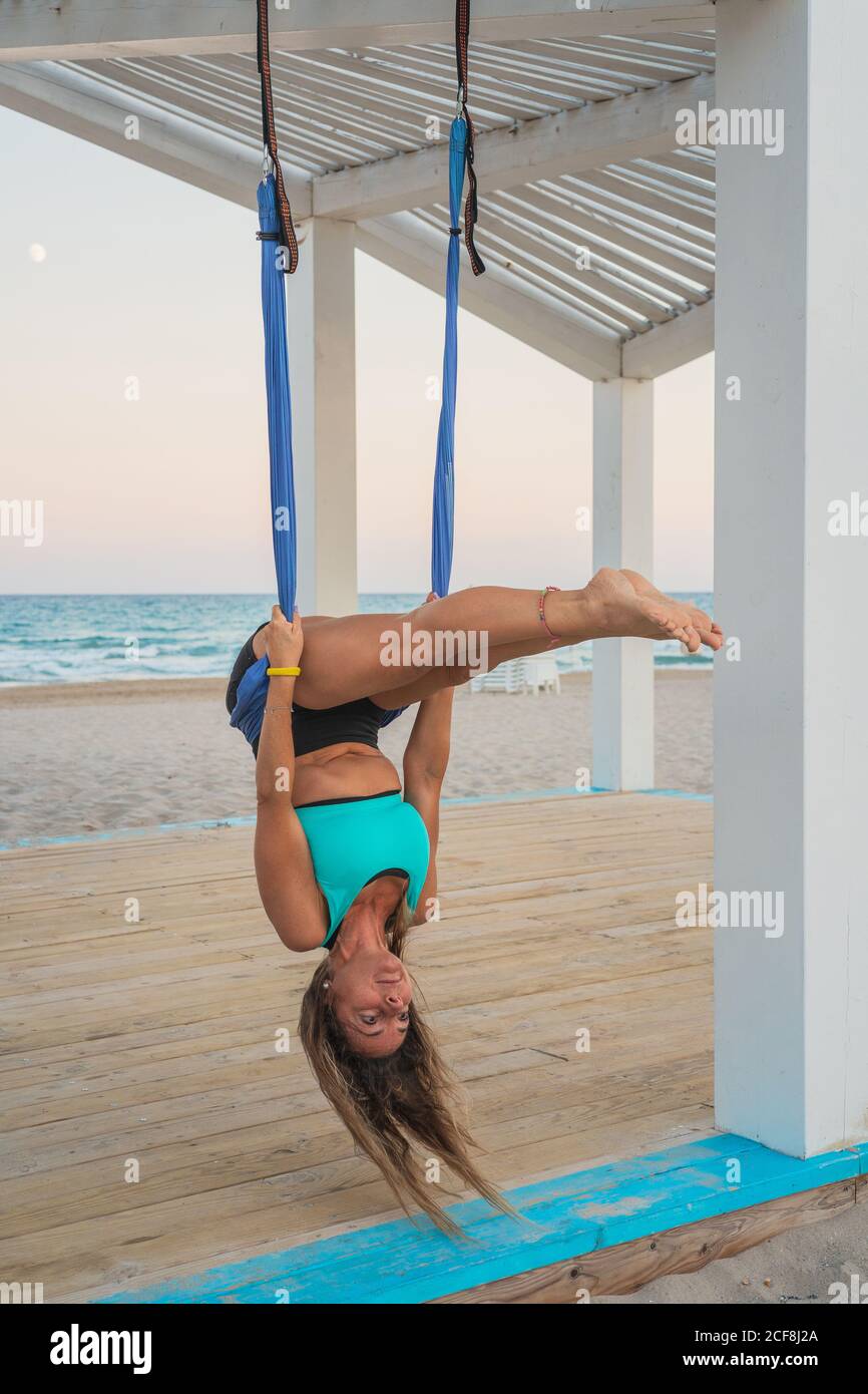 Hanging upside down yoga hires stock photography and images Alamy