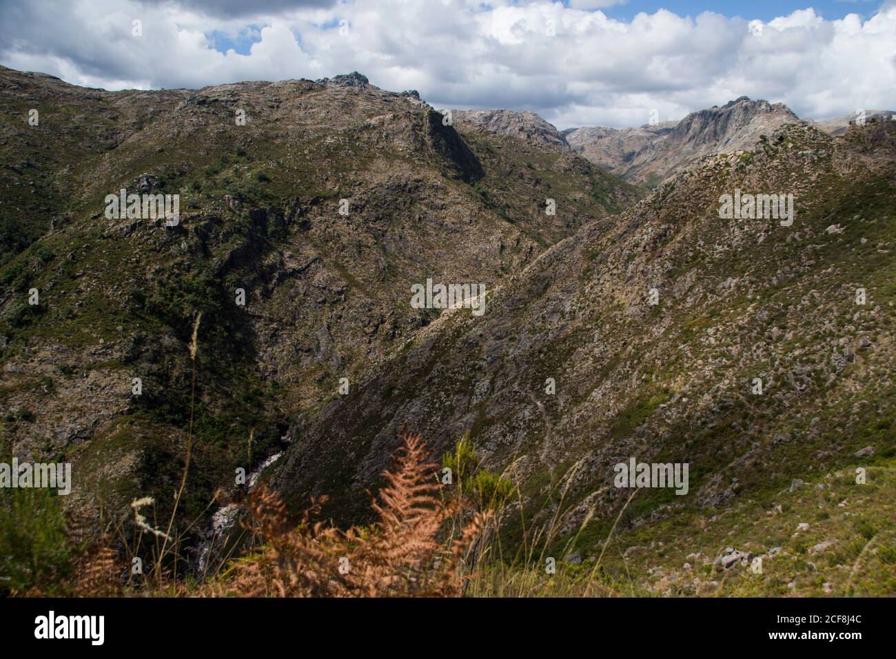 A deep valley between high mountains seen from above Stock Photo Alamy