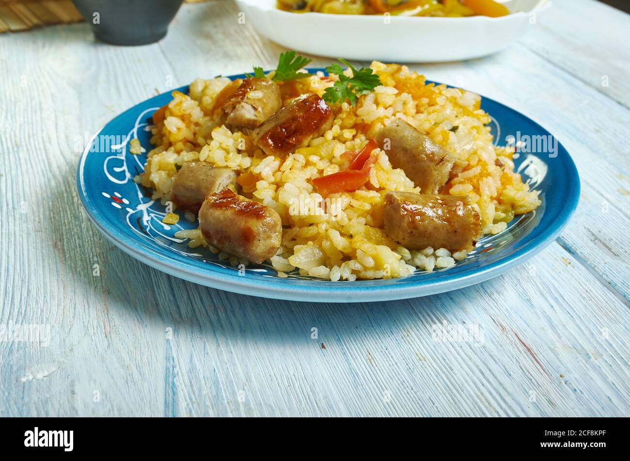 Sausage squash risotto chopped butternut squash and chipolata sausages Stock Photo Alamy