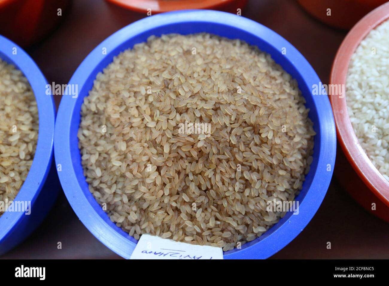 Brown Rice for sale, Calicut market, Kerala, India Stock Photo