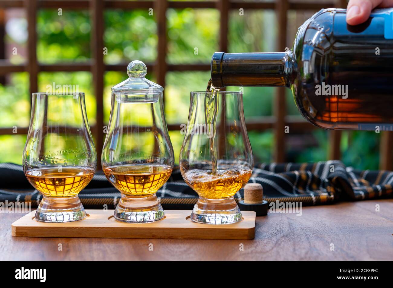 Tasting of different Scotch whisky drinks in traditional old British