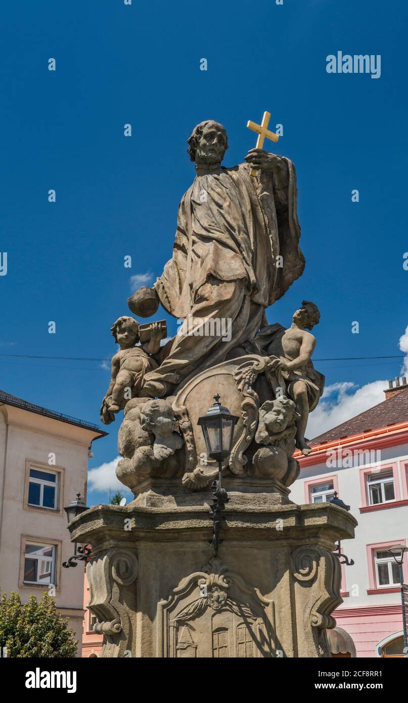 St John Sarkander statue at Komenskeho namesti, town square in Fulnek, Moravian-Silesian Region, Czech Republic Stock Photo