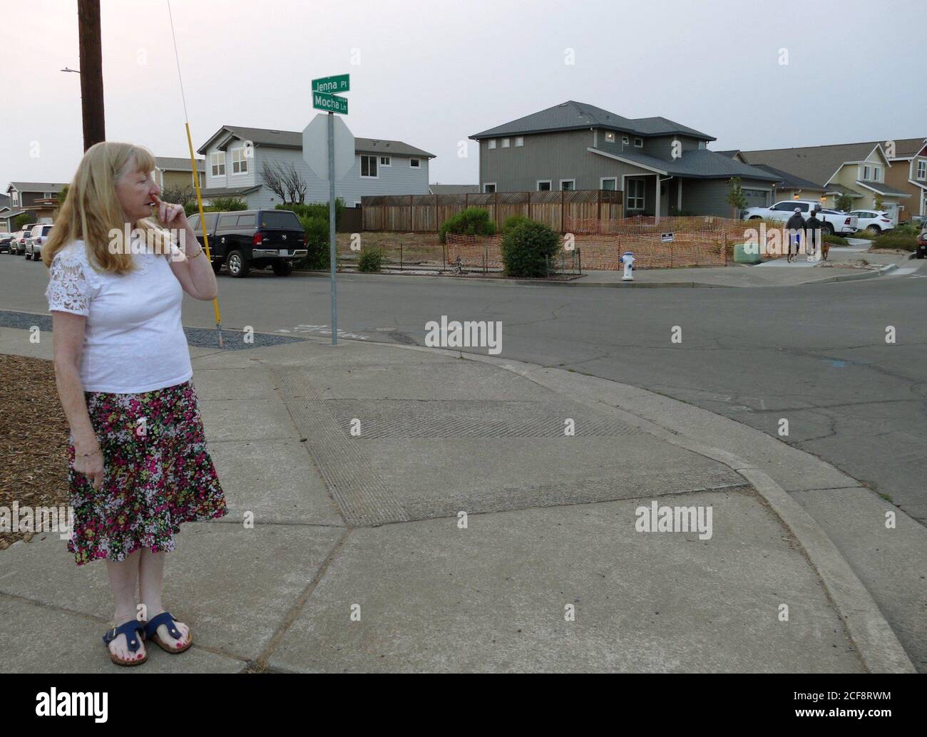 Santa Rosa, USA. 31st Aug, 2020. Astrid Granger stands on the corner of Jenna Place in Coffey Park, where she had lived for 30 years until the fire in 2017. In 2017 she and her husband lost their house in the Coffey Park neighborhood in the so-called Tubbs fire in Santa Rosa. (to dpa 'California becomes a fire hell - no end in sight') Credit: Barbara Munker/dpa/Alamy Live News Stock Photo