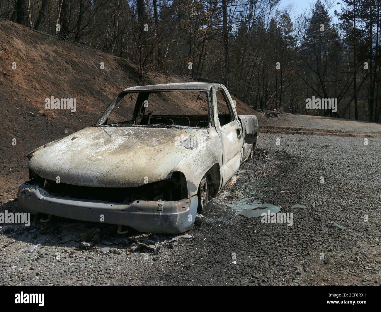 Healdsburg, USA. 31st Aug, 2020. A burnt out car on a lot along Mill