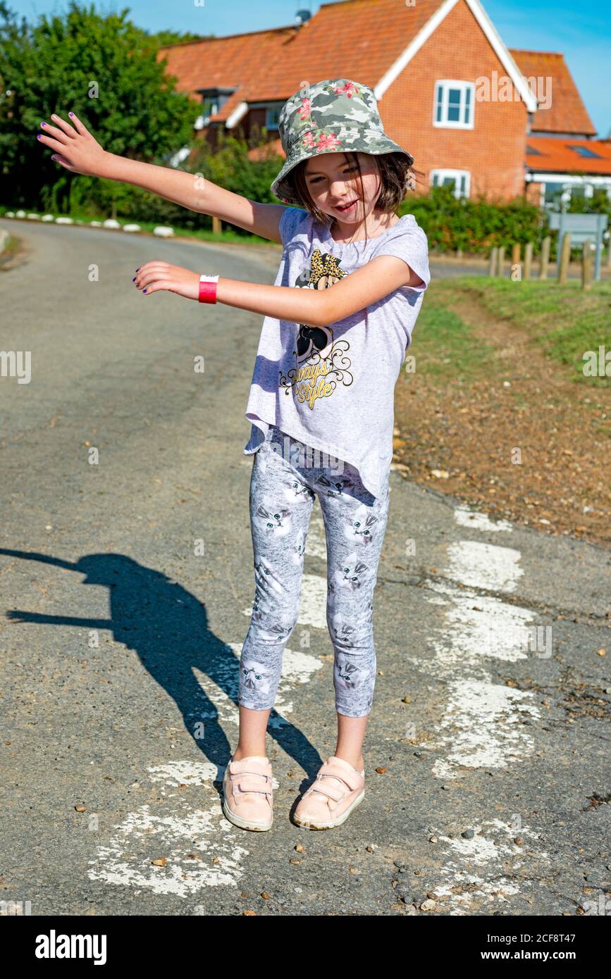 young girl dancing in the street Stock Photo
