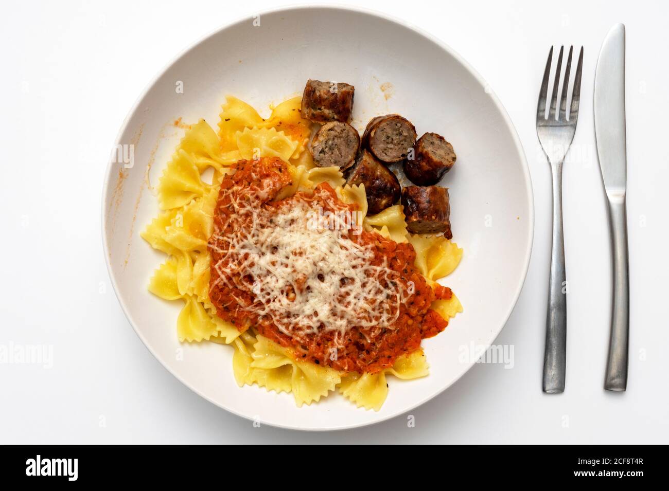 Pasta with tomato sauce cooked sausage and parmesan cheese Stock Photo