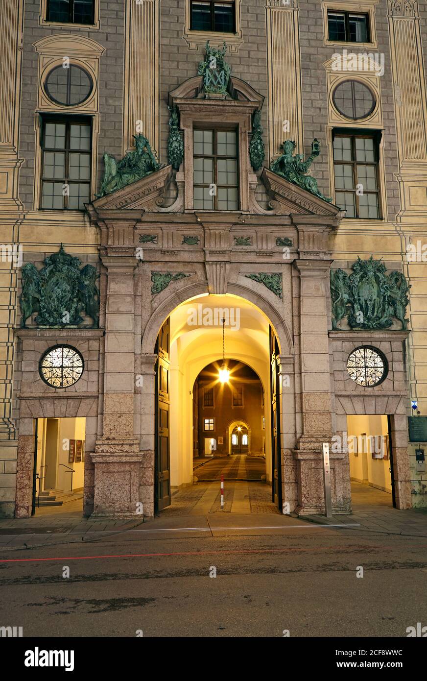 Architectural detail of the entrance to the Residenz (Neue Rathaus) illuminated at night Stock Photo