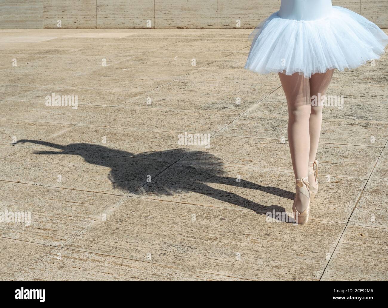 Ballerina standing on tiptoe classical position outside Stock Photo