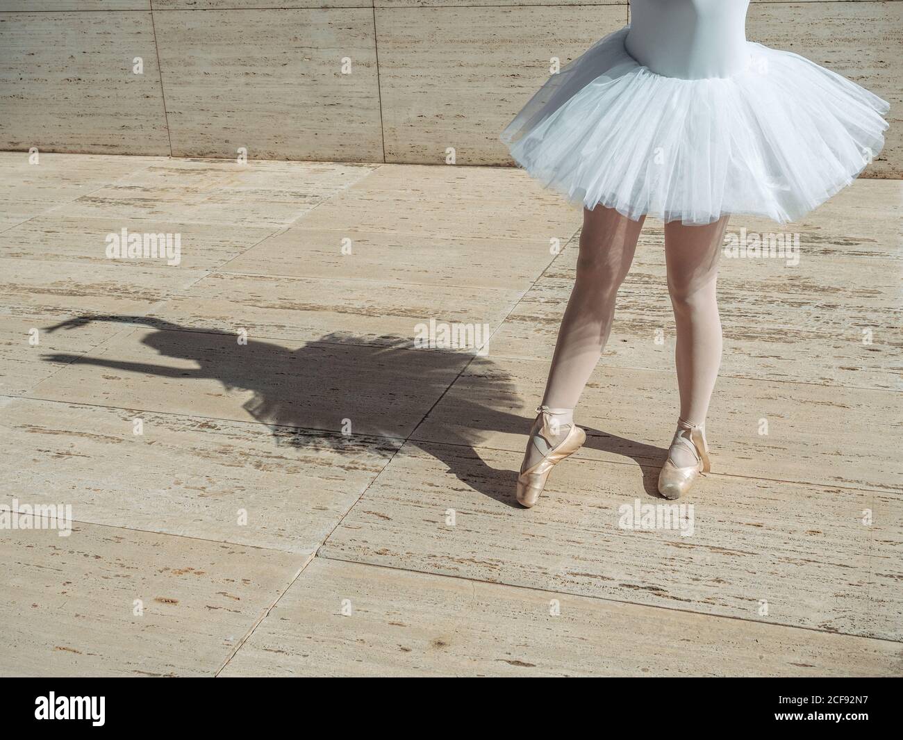 Ballerina standing on tiptoe classical position outside Stock Photo