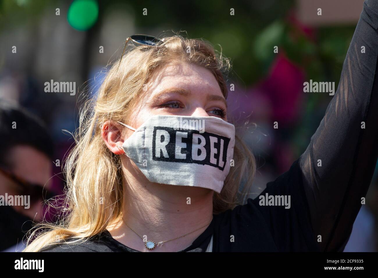A protester with 'rebel' face mask during Extinction Rebellion demonstration, Parliament Square, London, 1 September 2020 Stock Photo