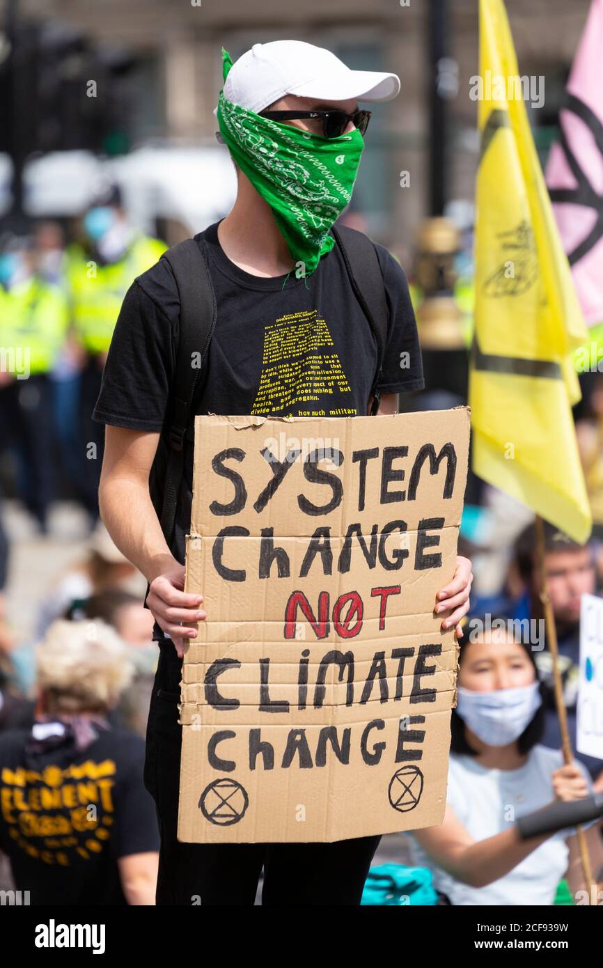 Protester holding a sign during Extinction Rebellion demonstration, Parliament Square, London, 1 September 2020 Stock Photo