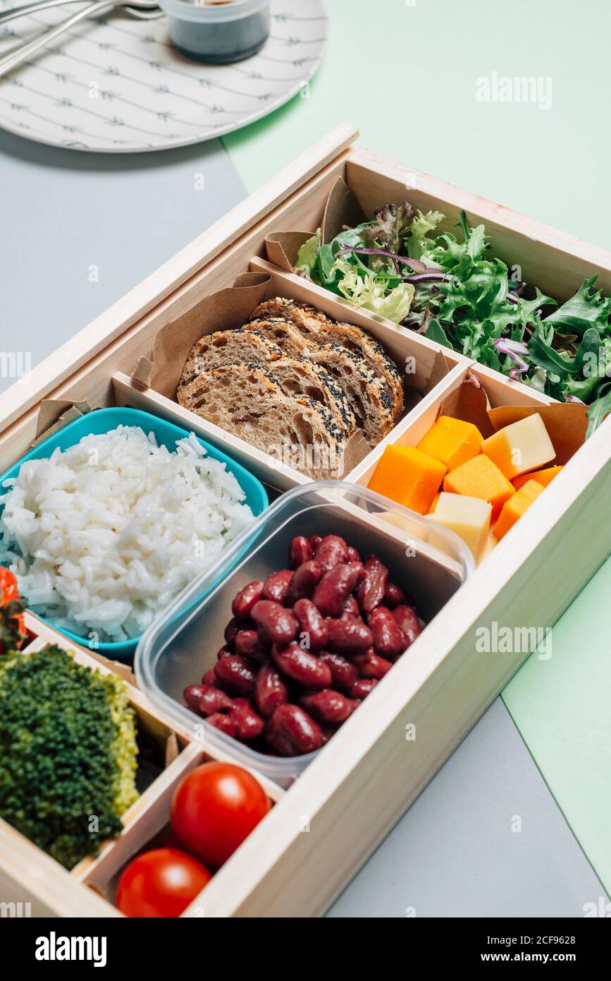 food box with diet ingredients by copybook and plate Stock Photo - Alamy