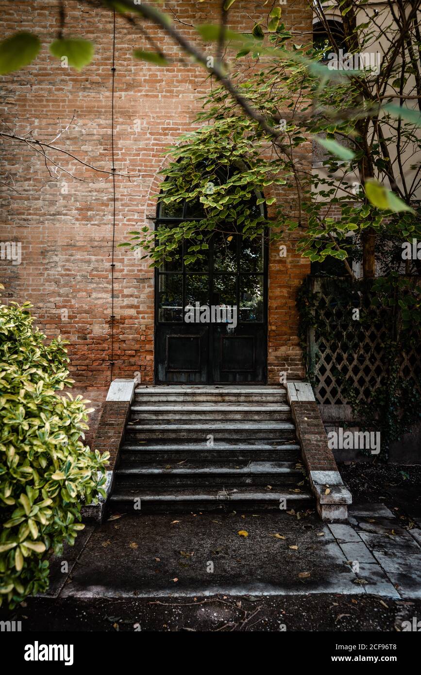 Iron window door and brick wall in an old building Stock Photo