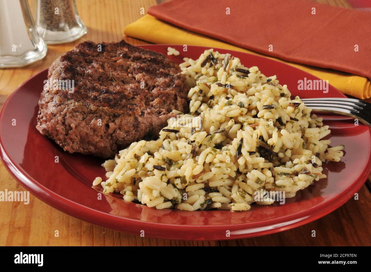 A grlled ground sirloin patty with long grain and wild rice Stock Photo