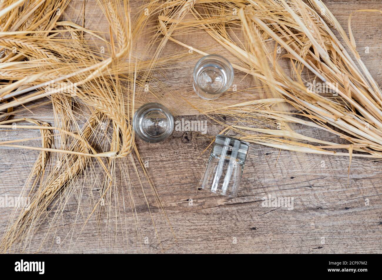 Clear whiskey shots on wooden table Stock Photo