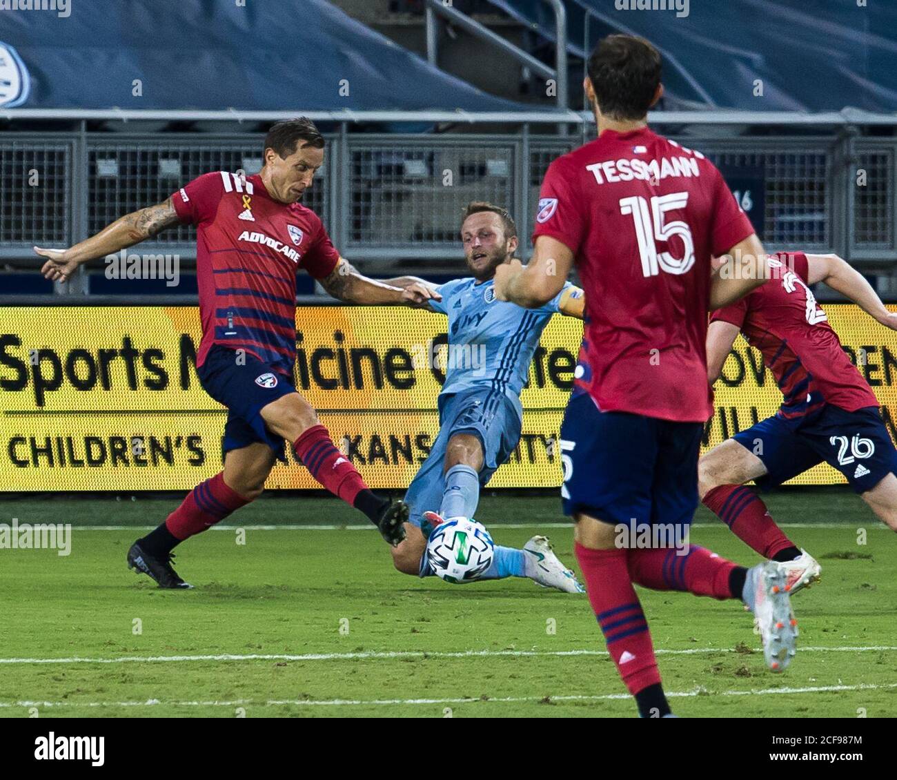 Kansas City, Kansas, USA. 2nd Sep, 2020. Sporting KC forward Johnny Russell #7 (r) makes a defensive tackle against FC Dallas defender Reto Ziegler #3 (l) during the first half of the game. Credit: Serena S.Y. Hsu/ZUMA Wire/Alamy Live News Stock Photo