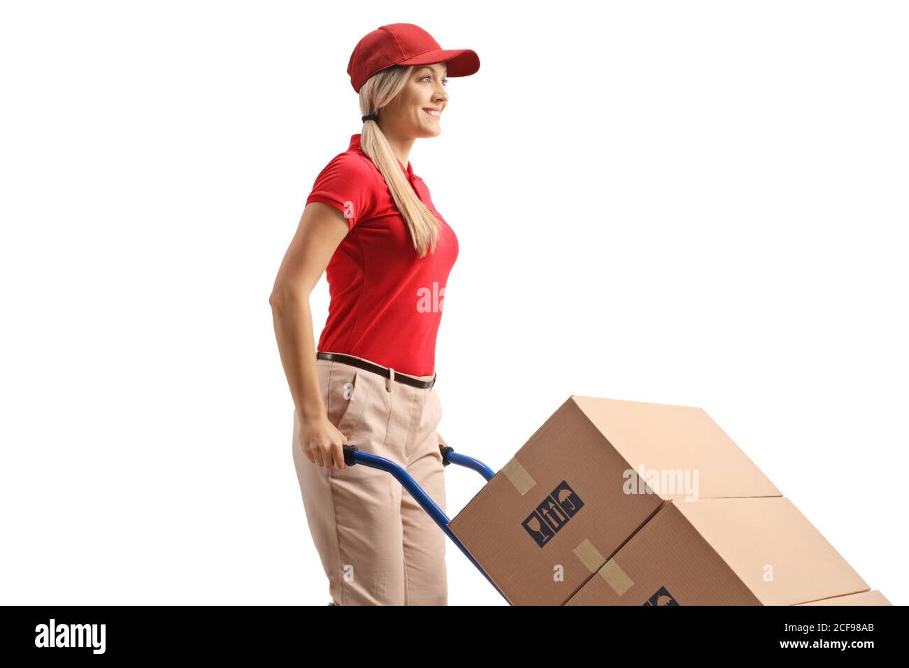 Woman worker pushing boxes on a hand truck isolated on white background Stock Photo