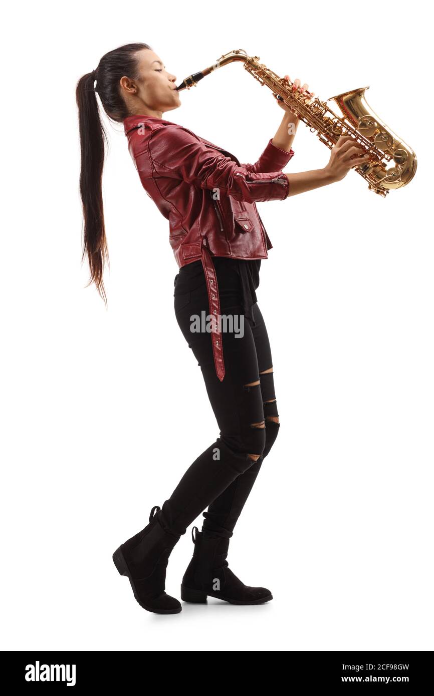 Full length profile shot of a female saxophonist with long black hair playing sax isolated on white background Stock Photo