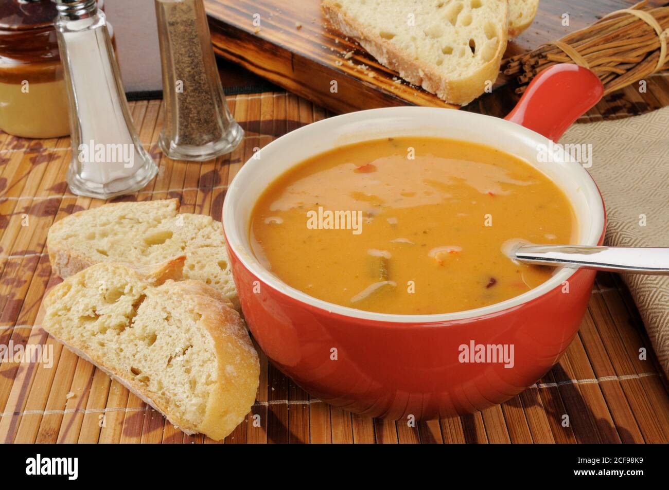 Creamy tomato bisque with gouda cheese and chicken Stock Photo Alamy