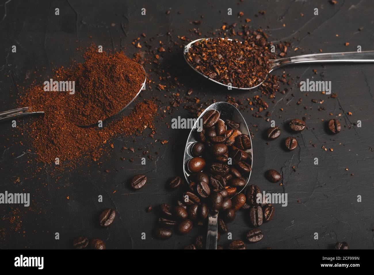 Types of coffee grounds instant and powder and coffee beans in spoons