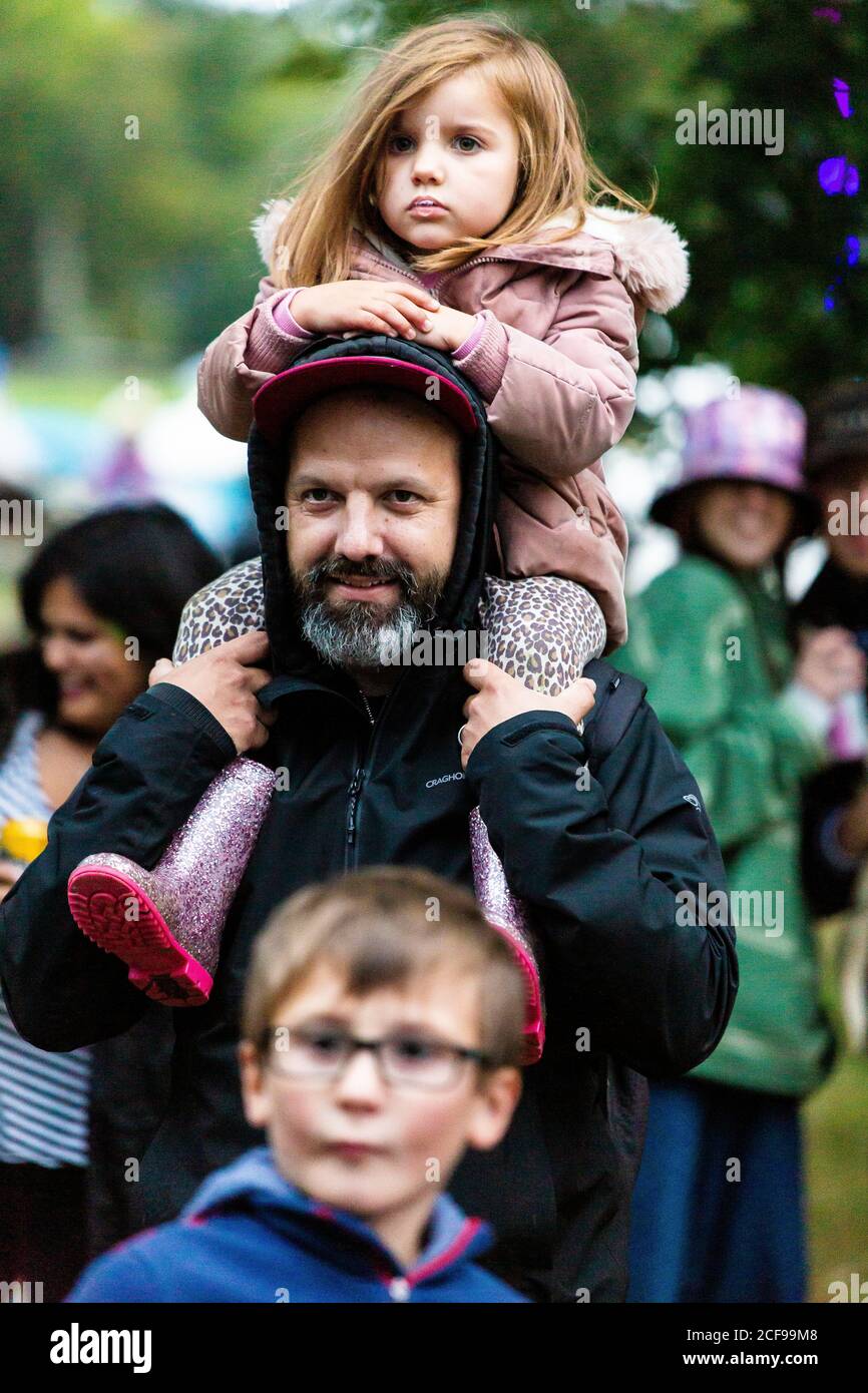 Family enjoying festival vibes at We Are Not a Festival socially distanced camping event in Pippingford Park Stock Photo
