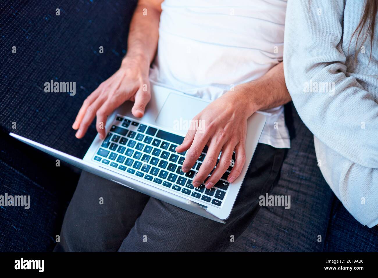 close-up of hands using a computer at home Stock Photo
