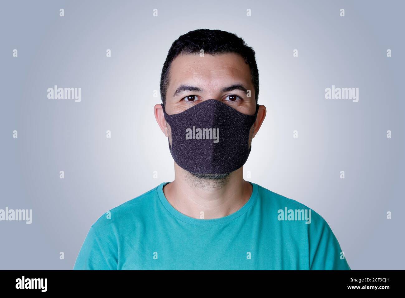 portrait handsome young adult white man wearing dark protection mask
