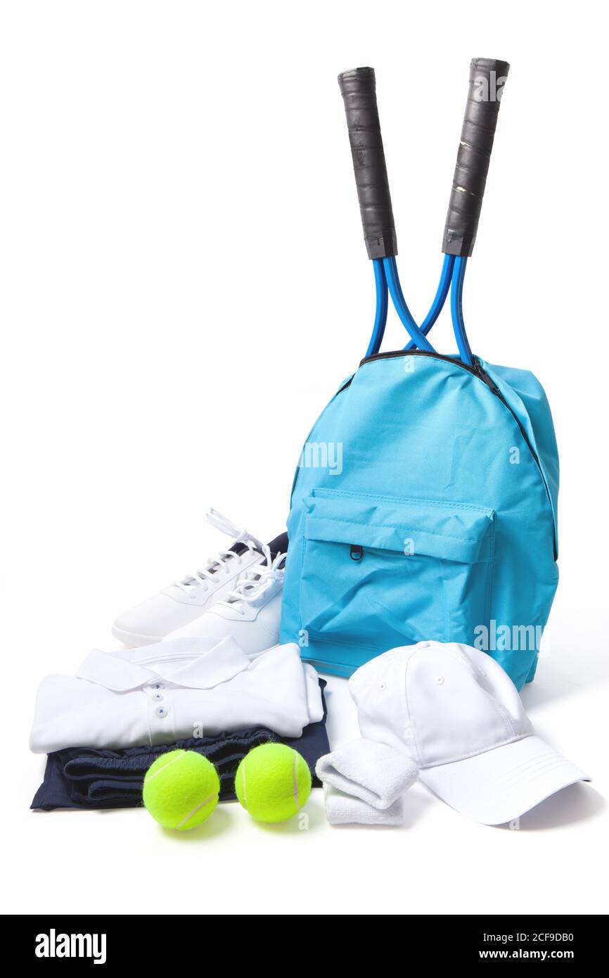Tennis shirt, shoes, bag with rackets, hat and balls isolated on white. Image with path. Stock Photo