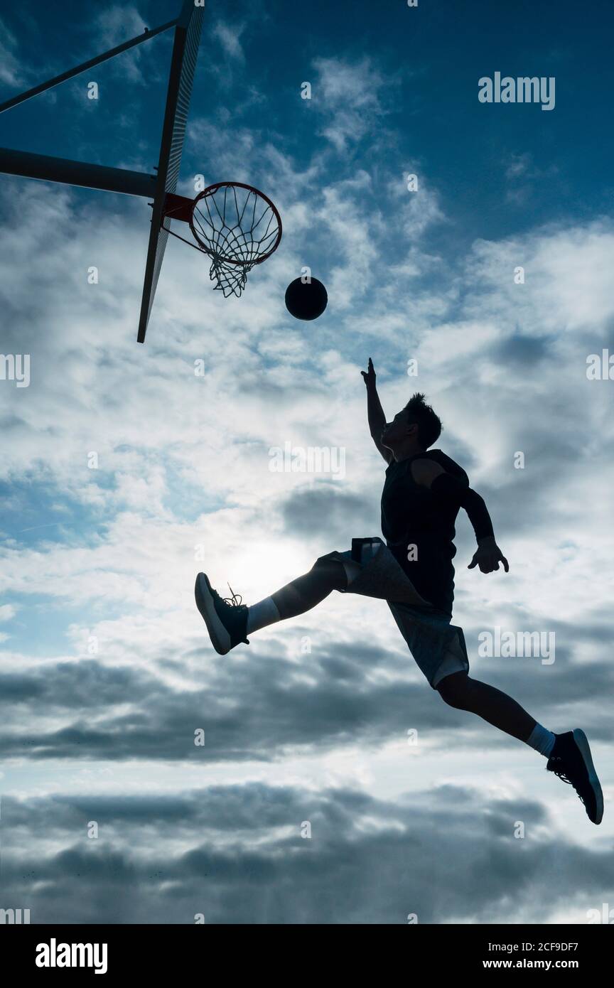 Young Man Playing On Basketball Court Outdoor Stock Photo Alamy