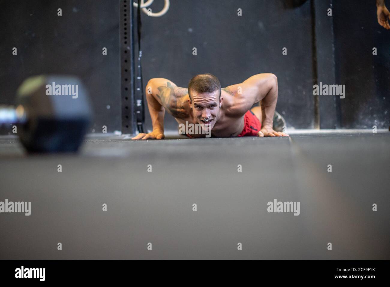Fit man doing push-ups Stock Photo