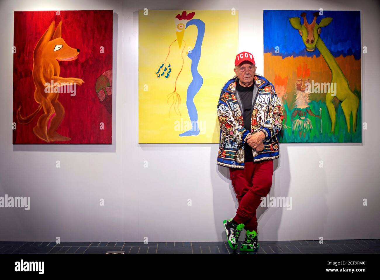 Fashion and portrait photographer David Bailey stands in front of three of his 50 unseen oil paintings that form part of his new exhibition which opens on September 7 at the W1 Curates Gallery, at Flannels, Oxford Street, London. Stock Photo