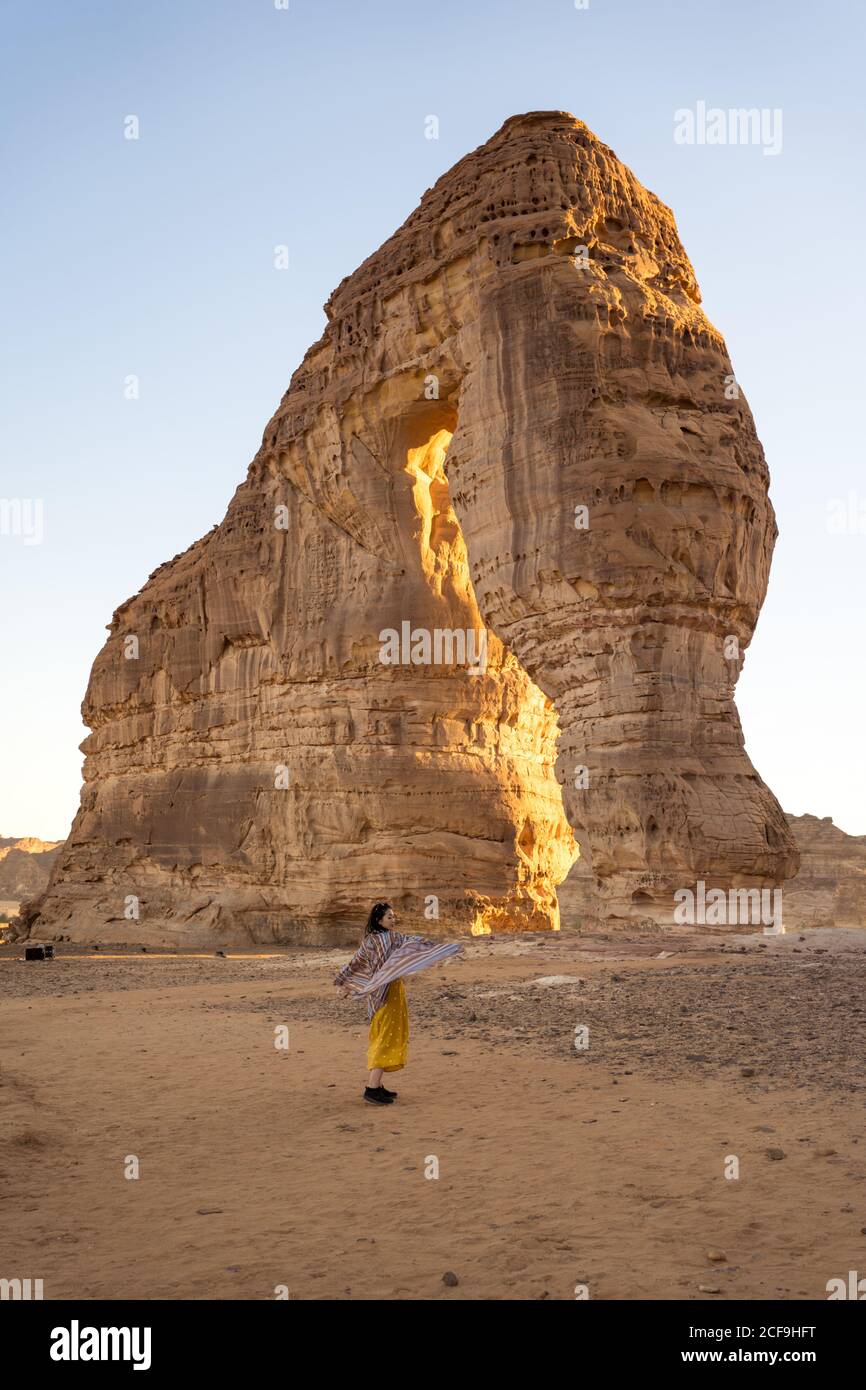 unrecognizable Woman in casual clothes enjoying sightseeing in the Edge of the World in Saudi Arabia Stock Photo