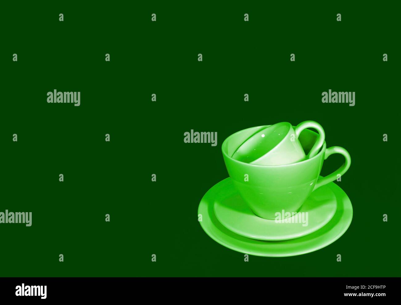 Pop art style green color tone stack of two different size of coffee cup sets Stock Photo