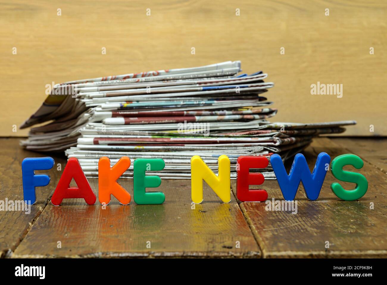 Closeup shot of Fake news concept with newspapers and letters. Stock Photo