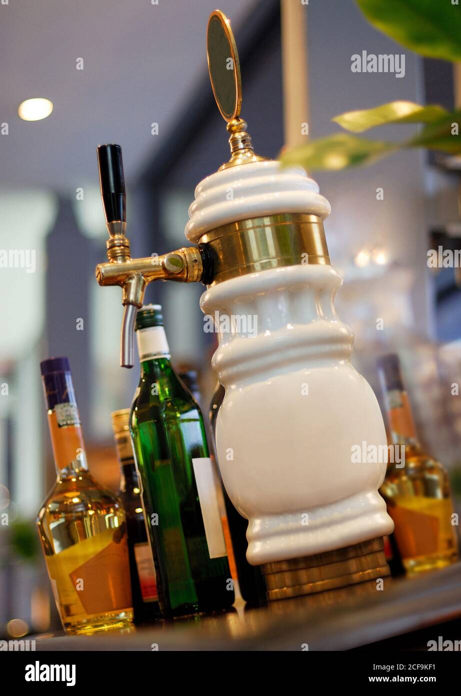 Draft beer dispenser on bar counter Stock Photo