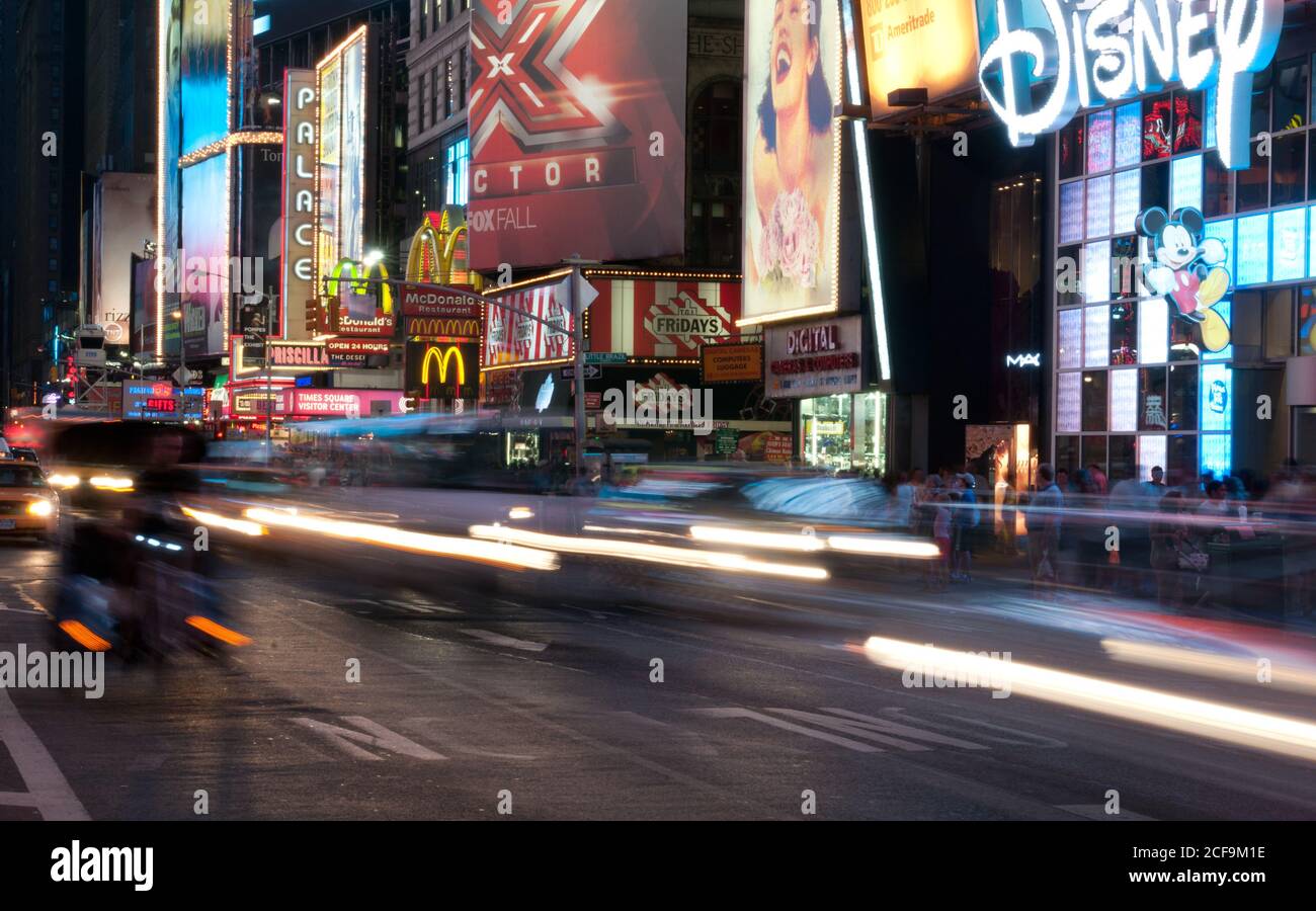New York Times Square with illuminated billboards and moving cars, USA Stock Photo