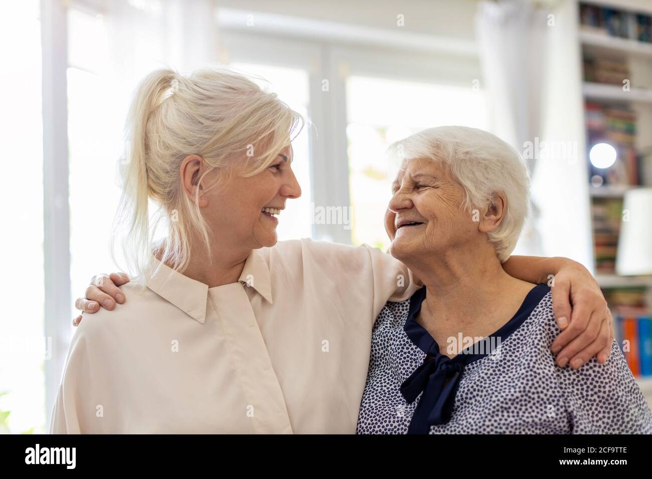Woman spending time with her elderly mother Stock Photo